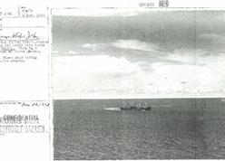 1943(昭和18)年11月Rabaul北方洋上で米軍哨戒機PB4Yからの直撃弾をうけた日本船。後方に攻撃を回避中の日本船が見える。